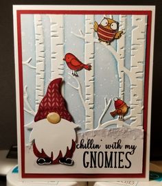 a card with gnomes and birds on it