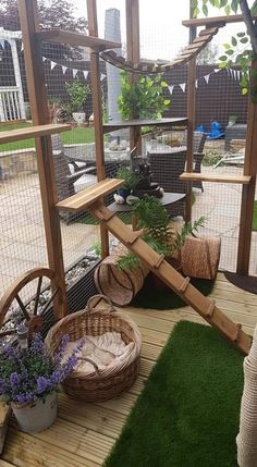 a wooden deck with plants and baskets on it