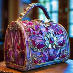 Welcome to my high-concept designer handbag art, intended for the wall or a shelf, possibly as part of a retail display.  Art Description: This exquisite handbag concept exudes a sense of grandeur, reminiscent of antique stained glass windows infused with modern opulence. Its primary color palette is dominated by rich purples, ranging from lavender to deep violet, accented by bold crimson and fuchsia jewels. The floral motifs, particularly the prominent daisy with a radiant gem at its center, bring a whimsical and organic touch to the structured, barrel-like silhouette of the handbag. The intricate craftsmanship is evident in the delicate filigree that frames each section of the bag, with golden lines outlining the stained glass-like segments, imbuing it with a luxurious and ornate feel. T Elegant Hand Painted Rectangular Bags, Elegant Hand Painted Rectangular Bag, Artistic Rectangular Evening Bag, Glass Concept Art, Antique Stained Glass Windows, Antique Stain, Fashion Event, Retail Display, Red Accents