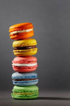 a stack of colorful macaroons sitting on top of each other