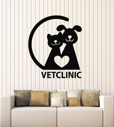 a wall decal with the words vetclinic and two dogs in a circle