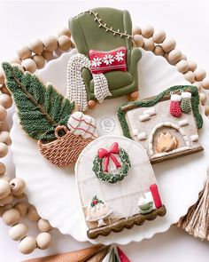 decorated cookies and decorations on a plate