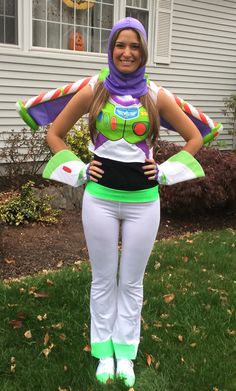 a woman dressed as buzz lightyear from toy story in front of a house with her hands on her hips