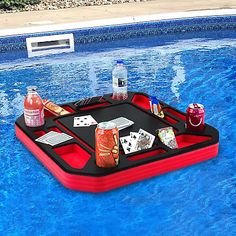 an inflatable pool float with cards and drinks on it