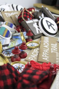 a table topped with lots of different types of buttons and magnets on top of each other