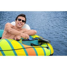 a man is sitting on an inflatable boat