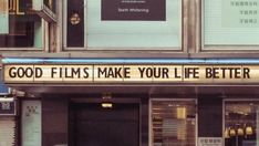 a sign that says good films make your life better on the outside of a building