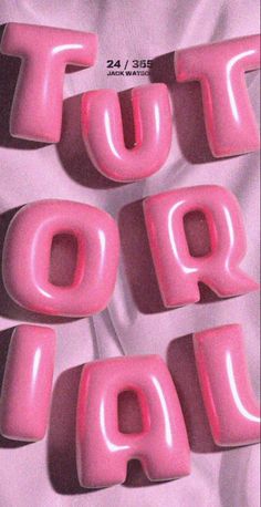 four pink letters that spell out the word top pop on a white sheeted surface