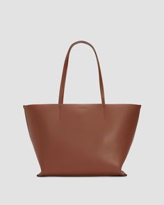 The Luxe Medium Italian Leather Tote Cognac – Everlane Luxury Shoulder Bag With Leather Handles For Everyday, Classic Soft Leather Shoulder Bag For Shopping, Classic Shoulder Bag With Smooth Grain For Shopping, Classic Smooth Grain Shoulder Bag For Shopping, Classic Soft Leather Shoulder Bag For Daily Use, Classic Daily Soft Leather Shoulder Bag, Classic Smooth Grain Tote Shoulder Bag, Luxury Large Capacity Shoulder Bag For Daily Use, Classic Daily Shoulder Bag