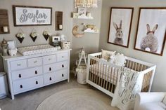 a baby's nursery room with white furniture and pictures on the wall above the crib