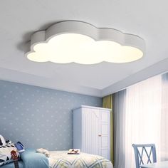 a bedroom scene with focus on the ceiling light