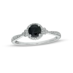 Start your endless love story with this vintage-inspired gemstone and diamond engagement ring. Fashioned in cool 10K white gold, this look showcases a 5.0mm rich black sapphire surrounded by a frame of shimmering diamonds. Trios of bezel-set diamonds in milgrain-lined frames flank the center while additional diamonds adorn the milgrain-detailed tapered shank. Radiant with 1/10 ct. t.w. of diamonds and a bright polished shine, this engagement ring reflects your unique romance. Classic Cluster Ring With Birthstone In Round Cut, Classic Sapphire Ring With Diamond Accents For Promise, Classic Birthstone Cluster Ring With Round Cut, Classic Round Cut Cluster Ring With Birthstone, Classic Cluster Birthstone Ring, Timeless Birthstone Ring With Accent Stones For Anniversary, Classic Diamond Rings With Birthstone, Classic Diamond Ring With Accent Stones For Anniversary, Classic Anniversary Diamond Ring With Accent Stones