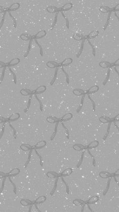 a gray background with bows and snow flakes