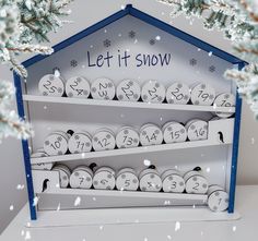 a snow themed display case with lots of numbers on the front and sides, surrounded by snowflakes