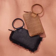 A HOBO icon and best seller, Sable is our circular handle clutch made for grabandgo moments. Sable Wristlet Wallet in Raffia With Leather Trim  Black HB Clutch Bag in Black | Hobo® Chic Clutch With Braided Handles For Everyday, Chic Everyday Clutch With Braided Handles, Everyday Clutch With Round Handle, Chic Handheld Clutch For On-the-go, Chic Black Summer Clutch, Chic Handheld Woven Clutch, Chic Woven Handheld Clutch, Chic Black Woven Clutch, Black Woven Clutch