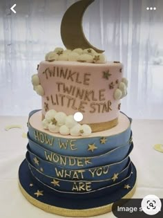 a three tiered cake decorated with stars and the words twinkle little star on it