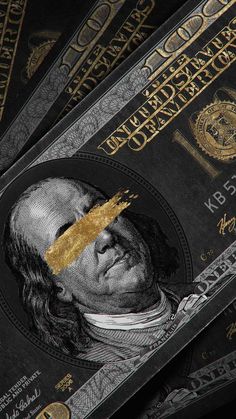 a pile of twenty dollar bills with gold foil on them