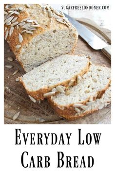 a loaf of bread sitting on top of a wooden cutting board