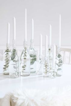 an image of some glass bottles with candles in them on a table and the caption below it reads, follow