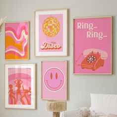 a bedroom with posters on the wall and a bed in front of it, including a pink telephone