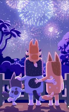 two dogs are standing next to each other with fireworks in the background