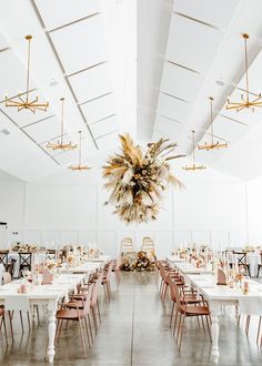 a large dining room with tables and chairs set up for a formal dinner or party