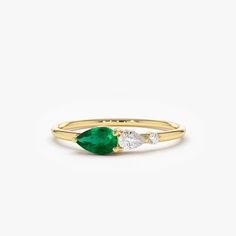 "Emerald Ring / 14k Gold Pear Shape Emerald with Pear Shape Diamond Ring / Tear Drop Emerald Ring / Promise Ring / May Birthstone Ring Item Details * Made to Order.  * Gold Kt: 14K Solid Gold * Custom Gold Color: Rose Gold, Yellow Gold, White Gold * Pear Shape Diamond: 1 Pcs 3x2 * Round Diamond: 1 Pcs 1.50MM * Pear Shape Emerald: 1 Pc 5x3MM * Total Diamond CTW: 0.10 ctw * Total Emerald Ctw: 0.20 ctw * Diamond Color-Clarity: G Color SI Clarity * Width of Band: 1.30MM * Setting Type: Prong * Ready to Ship in 7-10 Business Days If you have any additional questions about this ring, just hit the \"Ask a Question\" button (just to the right of the price) and we will get back to you within a few hours.  ▶ See more of our  Emerald Jewelry - https://etsy.me/3QCyZBQ ▶ See our storefront here - http: Fine Jewelry Emerald Ring With Pear Gemstone, Pear-shaped Emerald Ring In Fine Jewelry Style, Pear-shaped Emerald Ring, Fine Jewelry, Pear-shaped Multi-stone Fine Jewelry Ring, Yellow Gold Three Stone Pear-shaped Ring, Pear Shaped Multi-stone Ring As Gift, Pear Shaped Multi-stone Ring For Gift, Pear-shaped Multi-stone Ring For Gift, Fine Jewelry Yellow Gold Pear-shaped Ring