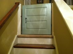 an open door on the side of a set of stairs