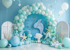 an ocean themed birthday party with balloons and decorations