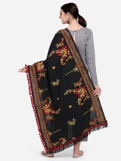 This black shawl/dupatta is crafted in organic khadi cotton fabric. It is Heavily aari Embroidered with different kashmiri motif. It is fenced with wine dyed cotton tassel lace and fringe lace on both the ends. For winters it is perfect as a fancy shawl and for festive it is perfect to carry on your fancy outifit. Color: Black Fabric: 100% cotton base khadi Fabric Work Details: Embroidered, embellished with fancy laces and fringes Meausrements: Length - 200 CM Width - 75 CM Note: The product wil Fancy Laces, Khadi Fabric, Fancy Shawl, Garba Dress, Thread Tassels, Tassel Lace, Linen Shawl, Fancy Outfit, Fabric Work