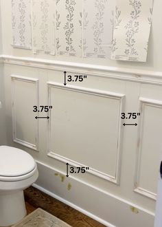 a bathroom with measurements for the size of the toilet and wall paneling in it