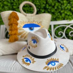 Hand Painted Eye Palm Tote and Hat Set Wide Brim Canvas Sun Hat For The Beach, Bohemian Hand Painted Sun Hat For Vacation, Bohemian Hand Painted Sun Hat For Beach, Bohemian Hand Painted Sun Hat For The Beach, Hand Painted Straw Hat For Beach Summer, Hand Painted Straw Hat For Beach In Summer, Summer Vacation Hand Painted Sun Hat, Artistic White Hat For Vacation, White Hand Painted Hat For Vacation