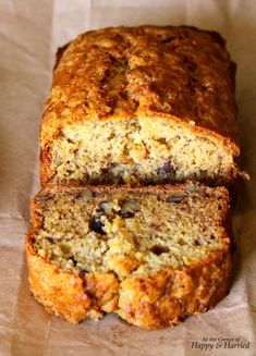 a loaf of banana bread sitting on top of a piece of wax paper