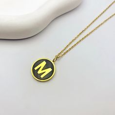 For the modern minimalist, our Alphabet Letter Round Black Initial Charm Necklace is a must-have accessory! This sleek and stylish necklace is available in both gold and silver, featuring a cute black and gold initial charm that adds a personalized touch to any outfit. Choose your favorite letter or stack multiple necklaces for a trendy accessory that's perfect for expressing yourself in style. Available in gold and silver. Trendy Personalized Black Necklace, Trendy Black Personalized Necklace, Personalized Black Stainless Steel Necklaces, Gold Minimalist Initial Necklace In Stainless Steel, Minimalist Gold Stainless Steel Initial Necklace, Black Round Pendant Necklace For Personalized Gift, Black Round Minimalist Charm Necklaces, Minimalist Black Round Charm Necklaces, Minimalist Black Charm Necklaces