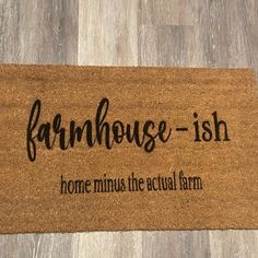 a door mat with the words farmhousee - ish and home minus the actual farm on it