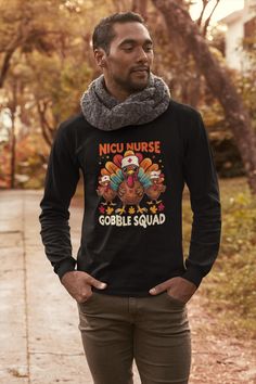 This "NICU NURSE GOBBLE SQUAD" funny turkey design Unisex Long Sleeve Shirt is the perfect Thanksgiving Shirt/Gift for NICU Nurses! All of our shirts are super soft and cozy! :: GILDAN Brand Ultra Cotton Shirts          :: Environmentally-friendly manufactured cotton that gives a thicker vintage feel :: Classic Fit Unisex Long Sleeve Shirts :: Props used in photos or videos are NOT included with purchase WASHING INSTRUCTIONS :: Wash inside out, in cold water, on gentle cycle. Tumble dry low or let air dry :: Do not use Fabric Softeners or Bleach :: Do not dry clean         :: Do not iron  SIZE :: Please take a look at the photos for a specific sizing chart for this t-shirt style :: Lay your shirt at home flat and measure armpit to armpit to compare to the size chart in the photos  RETURNS Thanksgiving Nurse Shirts, Funny Thanksgiving Shirts Nurses, Nurse Thanksgiving Shirt, Nicu Nurse Tshirt, Pre-shrunk Crew Neck Nursing Shirt, Pre-shrunk Nursing T-shirt With Crew Neck, Funny Turkey, Er Nurse, Nicu Nurse