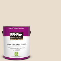 a can of behr premium plus paint and primer in one on a blue background