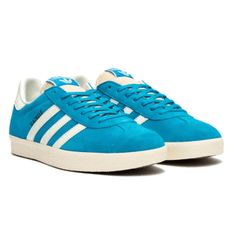 This Adidas Gazelle winks to the original design of the 60s, presenting several updates that convert the vintage shoe into a contemporary footwear icon. Made of leather coatings and soft cloudy, these red low sneakers have a retro foam tongue. Retro Blue Skate Shoes With Rubber Sole, Retro Skate Shoes With Rubber Waffle Outsoles, Adidas Retro Sneakers With Vulcanized Sole, Adidas Retro Sneakers With White Sole, Retro Adidas Sneakers With Rubber Waffle Outsoles, Blue Retro Sneakers With Round Toe, Blue Retro Lace-up Sneakers, Adidas Retro Sneakers With Gum Sole, Retro Blue Sneakers With Round Toe