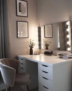 a white desk topped with a mirror and lights