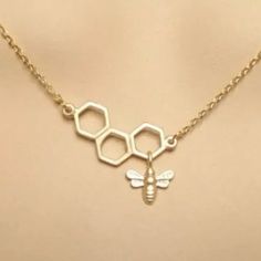 “Honeycomb” Beehive Apiary Swarm Sieve Hexagon Framework Pattern Polygonal Geometric Queen Bee Worker Bee Honeybee Bumblebee Honey Bug Insect Nature Bohemian Hippie Gold Necklace. Super Pretty Image Of A Piece Of Hexagonal Shaped Honeycomb Made By Hardworking Bees, With A “Queen” Bee Charm Dangling From It. On A Link Chain. New. *Matching Earrings Also Available! Measurements: Pendant Length: 1” Pendant Width: 1.5” Chain Length: 15” (+ 2” Extender Chain) If You Want It, Don’t Let It Get Away Sen Bumblebee Necklace, Red Pendant Necklace, Bumble Bee Necklace, Worker Bee, Clear Crystal Necklace, Blue Pendant Necklace, Flower Statement Necklace, Swarovski Crystal Hearts, Red Pendants