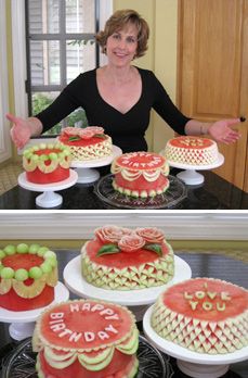 a woman standing in front of several cakes