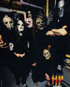 group of masked people posing for the camera