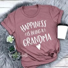 a t - shirt that says happiness is being a grandma with a heart on it