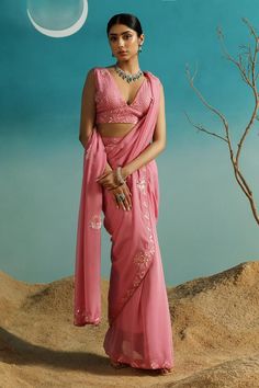 Pastel rose saree crafted in pure georgette base with placement sequin embroidery. Paired with a blouse with sequin embroidery
Components: 2
Pattern: Embroidery
Type Of Work: Sequins
Neckline: Deep V Neck
Sleeve Type: Sleeveless
Fabric: Pure Georgette
Color: Pink
Other Details: 
Note: The jewellery worn by the model is not for sale
Occasion: Sangeet - Aza Fashions Pastel Roses, Embroidered Saree, Sequin Embroidery, Pattern Embroidery, Blouse For Women, Sequins Embroidery, Pink Saree, Saree With Blouse, Blouse Online