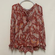 Olivaceous Blouse Top Button Down Front Paisley Print Collar Tie With Tassels Rust, Pink, Orange, Tan Size Large P2p: 24 In New With Tags Bohemian Blouse With Button Closure For Vacation, Bohemian Printed Button-up Top, Summer Red Blouse With Paisley Print, Red Bohemian Blouse With Paisley Print, Casual Long Sleeve Peasant Top With Paisley Print, Red Long Sleeve Blouse With Paisley Print, Red Bohemian Tops With Paisley Print, Red Bohemian Paisley Print Tops, Red Paisley Print Top For Vacation