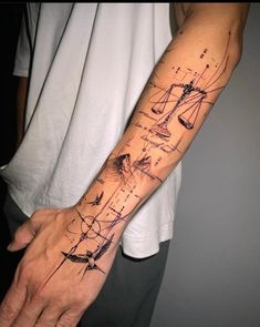 a man's arm with a drawing on it and his hand in the middle