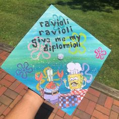 someone is holding up their graduation cap with the words, ravioli ravioli give me my diploma