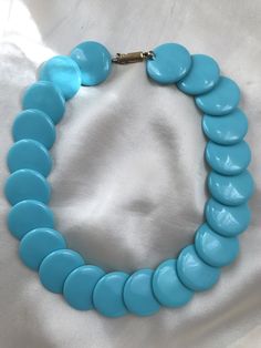 Vintage original necklace made of large flat turquoise beads. This is a stylish plastic necklace from the 60's.     The length of the necklace is 44 cm.     The quirky vintage lock works perfectly.     The beads are very good quality and make a nice sound when struck. The material of the beads is very similar to catalin. An extravagant necklace from the last century will brighten up your closet!       Very good condition for such a venerable age. The old thread has been replaced with a new one. Extravagant Necklace, Plastic Necklace, Original Necklace, Long A, 60s Fashion, Vintage Turquoise, Jewelry Inspo, Turquoise Beads, Bead Necklace