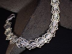 This lovely little vintage treasure is a sterling silver link bracelet featuring a sparkling diamond cut design. It measures 7.5" inches long x 3/8" wide and weighs 10.26 grams. Please bear in mind this is a previously owned and loved vintage treasure which shows signs of wear. Please inspect all photos prior to purchase. Items $100 or more are shipped in a high end jewelry presentation gift box. Items less then $100 will be packaged very nicely in a pretty little box, ready for gift giving or j Luxury Adjustable Sterling Silver Bracelet With Intricate Design, Luxury Sterling Silver Filigree Bracelet Gift, Jewelry Presentation, High End Jewelry, Silver Link Bracelet, Sparkling Diamond, Sparkle Diamonds, Cut Design, Silver Diamonds