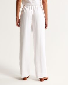 Elevate your wardrobe with the Abercrombie & Fitch Women's Linen-Blend Pull-On Pants, a perfect blend of comfort and chic style. These ultra high-rise, wide-leg pants are crafted from a soft and breathable linen-viscose blend, making them ideal for warm weather days.

- Size: XL
- Color: White
- Material: Body: Linen, Viscose; Lining: Viscose
- Gender: Female
- Style: Pull-on with an elasticated waistband for adjustable comfort

Designed for the modern woman, these pants feature a flattering sil Female Style, Women's Bottoms, Weather Day, Comfort Design, Linen Women, Pull On Pants, White Material, Modern Woman, Warm Weather